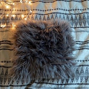 Fluffy grey throw pillow